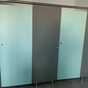 Green and blue HPL toilet cubicle for convention centers in a modern, high-traffic restroom setting.
