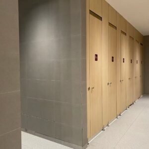Fully enclosed HPL toilet cubicle for shopping malls in a modern, high-traffic restroom setting.