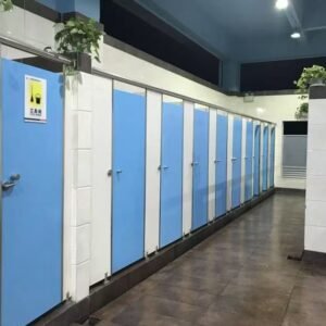 Fully enclosed HPL toilet cubicle for sports arenas in a modern, high-traffic restroom setting.